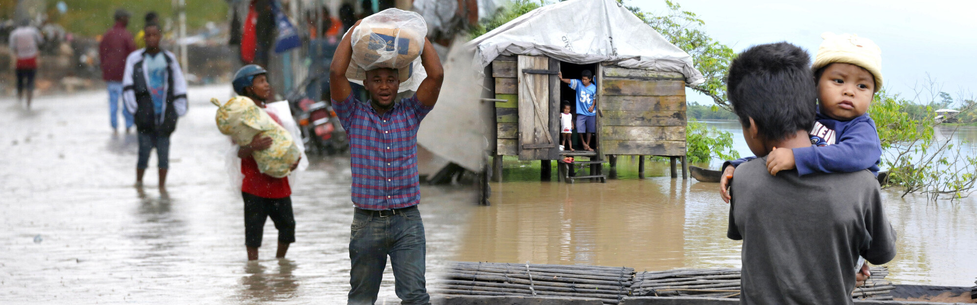 Betroffene des Hurrikans Matthew schleppen Sandsäcke durch das Wasser in Haiti.