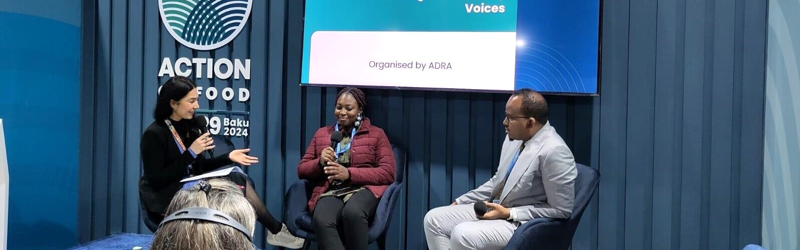 Mitarbeiter:innen von ADRA bei einem Panel auf der COP29