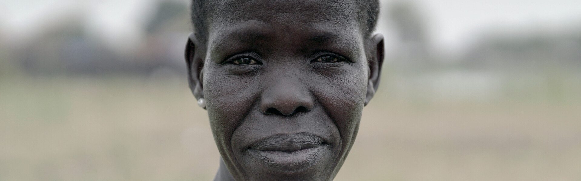 Eine Frau im Südsudan: Unser Bündnismitglied Johanniter unterstützt dort Menschen, die von der Landwirtschaft leben.