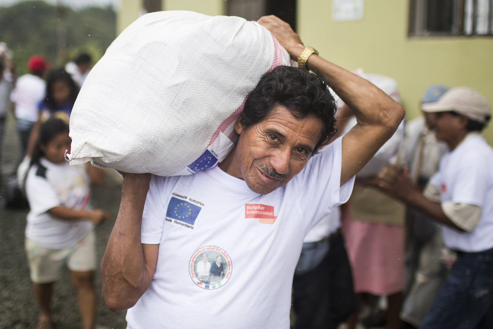 A man carries a food parcel