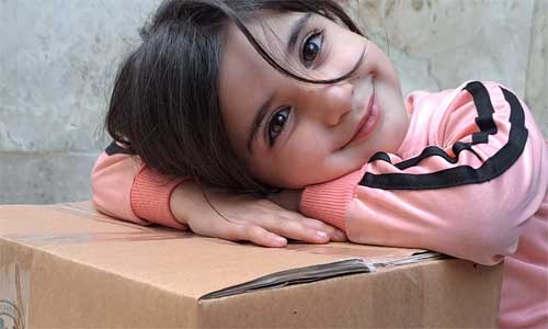 Girl in Syria is happy about aid package